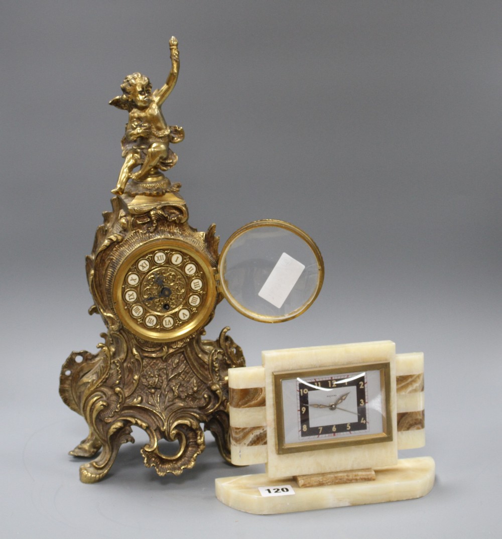 A Bayard two colour onyx mantel timepiece, height 15cm and a gilt metal mantel timepiece, height 42cm